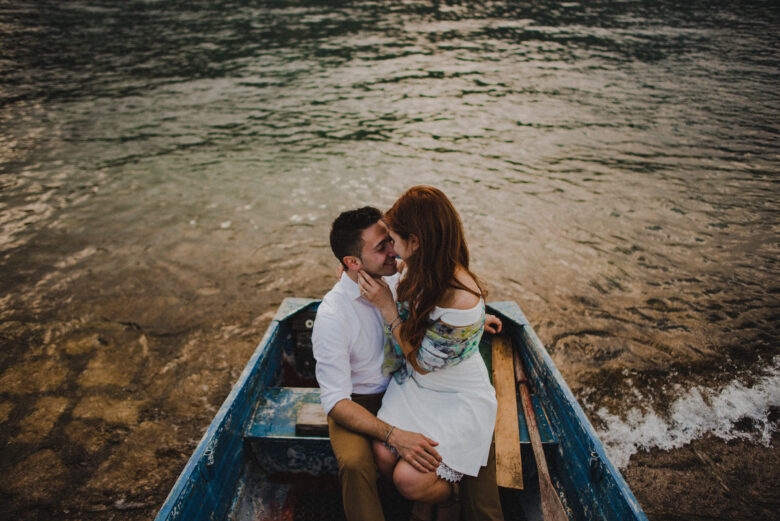 Couple on a boat on the lake maggiore, isole borromee, isola dei pescatori, stresa