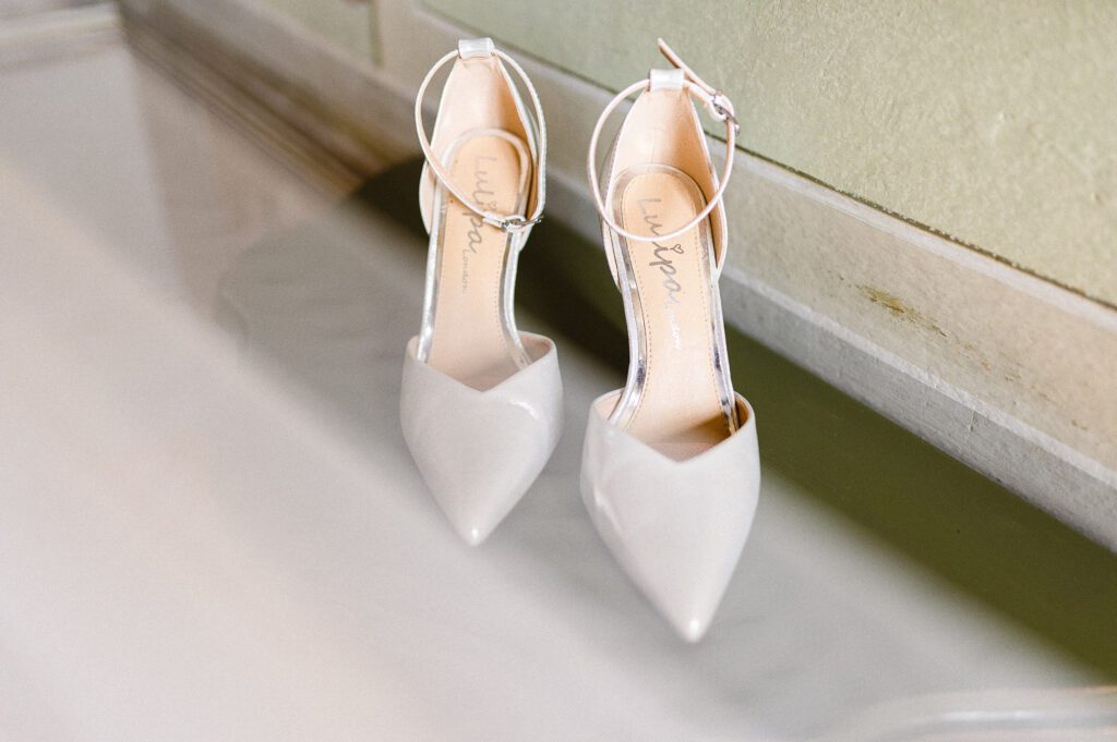 In a room reserved for the wedding at Palazzo Gambara, we see the bridal shoes on the floor.